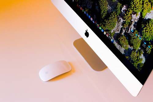 south africa turned-on silver iMac beside Apple Magic Mouse mouse